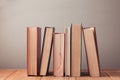 Old vintage books on wooden bookshelf