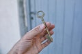 Old vintage brass door Key in mans hand Royalty Free Stock Photo