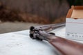 An old, vintage, break-action double-barrel shotgun featuring two triggers and two hammers. Royalty Free Stock Photo