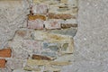 Old vintage brick and stone aall with crashed white plaster texture
