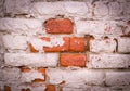 Old brick wall with shabby white paint background. vignette, architecture, texture. Royalty Free Stock Photo