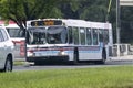 An old vintage Calgary transit bus on the route during summer