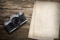 Old vintage camera with old paper Royalty Free Stock Photo