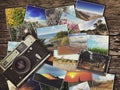 Old vintage camera and photos on a wooden background Royalty Free Stock Photo