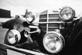 Old vintage car headlight close up. Black and white photo Royalty Free Stock Photo