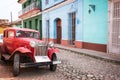 Old vintage car in a paved street of Trinidad Royalty Free Stock Photo