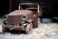 Old vintage car toy with rusty surface. Royalty Free Stock Photo