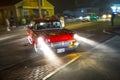 Old vintage cars at the 24th Annual Old Orchard Beach Maine Car Show drive along by night