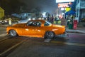 Old vintage cars at the 24th Annual Old Orchard Beach Maine Car Show drive along by night