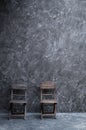 Old vintage chair wooden at dark concrete wall Royalty Free Stock Photo