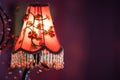 Old vintage chandelier with colorful textile cover on the wall with copyspace Royalty Free Stock Photo