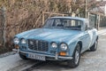 Old classic vintage blue Jaguar 2.8 litre parked