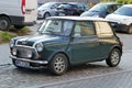 Old vintage classic dark green Morris Mini Cooper parked Royalty Free Stock Photo