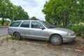Old vintage classic hatchback car silver grey Ford Mondeo one parked