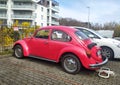 Old vintage classic red car Volkswagen Beetle left side and rear compartment view Royalty Free Stock Photo