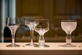Old and vintage collection of empty wine or champagne bubbles wine glasses on display Royalty Free Stock Photo