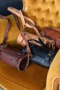 Old vintage leather tube shape bags with leather strap. Beautiful small women& x27;s leather bags in a vintage velor Royalty Free Stock Photo