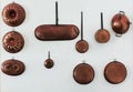 Old vintage copper cookware on the white wall. Royalty Free Stock Photo