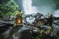 Old vintage copper lantern with burning candles inside as wedding decoration