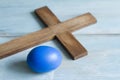 Old vintage cross and abstract blue easter egg Royalty Free Stock Photo