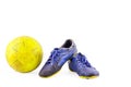 Old vintage damaged futsal sports shoes and ragged yellow ball on white background football object isolated Royalty Free Stock Photo