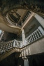 Old vintage decorated spiral taircase in abandoned mansion Royalty Free Stock Photo