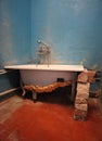 Old vintage dirty broken bathroom. Trash repairs. Grunge vertical background