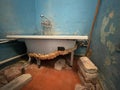Old vintage dirty broken bathroom. Trash repairs