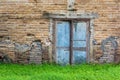Old Vintage Door On The Old Brick Wall And Green Grass Royalty Free Stock Photo