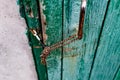 Old vintage door handles. Rusty metal locks and latches. Protective devices for wooden yard Royalty Free Stock Photo