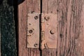 Old vintage door handles. Rusty metal locks and latches. Protective devices for wooden yard Royalty Free Stock Photo