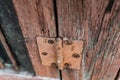 Old vintage door handles. Rusty metal locks and latches. Protective devices for wooden yard Royalty Free Stock Photo