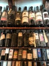 old vintage dusty wine bottles in the wine cabinet