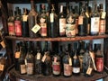 old vintage dusty wine bottles in the wine cabinet