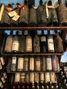 old vintage dusty wine bottles in the wine cabinet