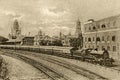 Old Vintage Early1900s photo of steam engine at Victoria Terminus railway station showing BMC building