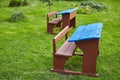 Old vintage empty school desks on a green lawn Royalty Free Stock Photo