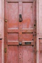 Old vintage english style red salmon pink front door with age re Royalty Free Stock Photo