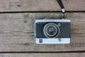 Old vintage film camera on rough wooden background with copy space. Top view Royalty Free Stock Photo
