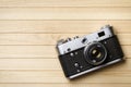 Old vintage film camera on wooden background Royalty Free Stock Photo