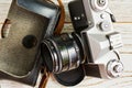 Old vintage film camera on the wooden table Royalty Free Stock Photo