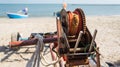 old vintage fishing reel with boat and sea in backgoround Royalty Free Stock Photo