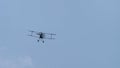 Old vintage flying biplane in the sky