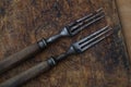 Old vintage forks on wooden background