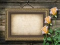 Old vintage frame for photos and a bouquet of yellow roses Royalty Free Stock Photo