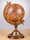 An old vintage globe on a small stand Royalty Free Stock Photo