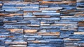 The old vintage gray blue and brown natural stone slate wall texture background in loft style Royalty Free Stock Photo