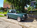 Old vintage green Morris Mini Cooper parked