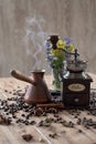old vintage hand grinder with Coffee beans and spices on wooden table Royalty Free Stock Photo