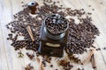 old vintage hand grinder with Coffee beans and spices on wooden table